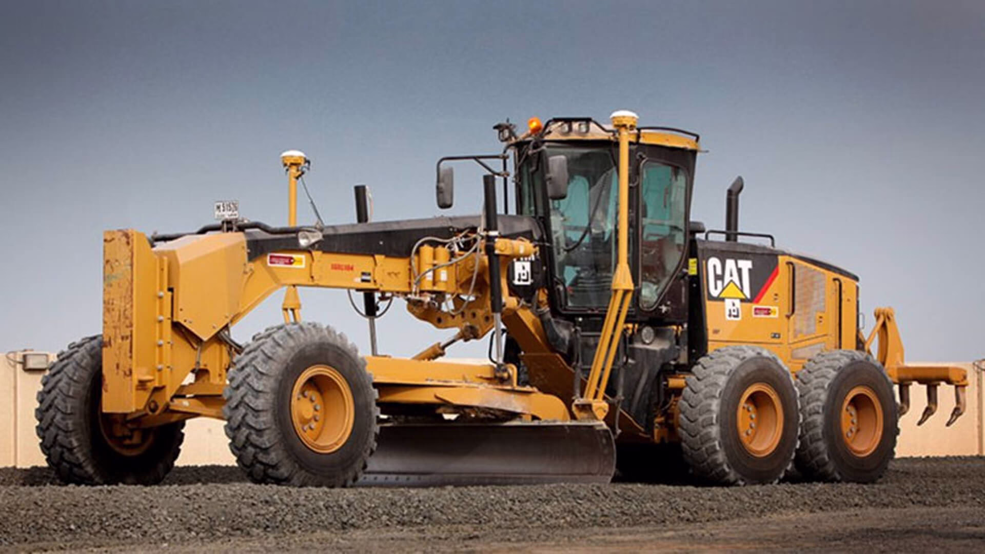 Loadscan solutions supporting earthmoving operations with a motor grader leveling and preparing ground on a construction or mining site.
